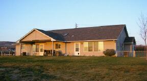 9440 Bittner Road Yakima, WA 98901 - Photo 3 of 8 a front view of a house with garden