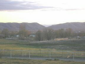 9440 Bittner Road Yakima, WA 98901 - Photo 4 of 8 a view of a yard with a mountain