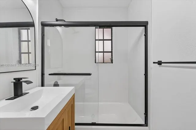 a bathroom with a sink and a shower