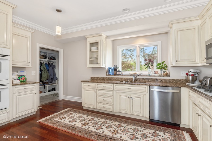 1032 Mar Ln Drive Lake Forest, IL 60045 - Photo 2 of 22 a kitchen with stainless steel appliances granite countertop a sink stove and refrigerator