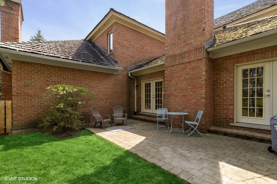 1032 Mar Ln Drive Lake Forest, IL 60045 - Photo 18 of 22 a backyard of a house with table and chairs