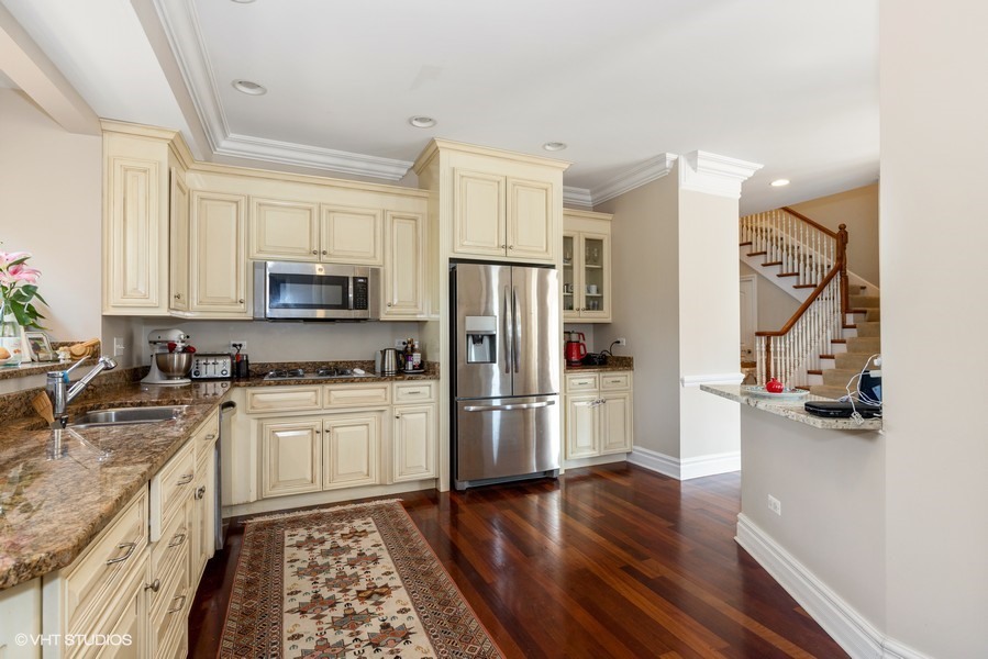 1032 Mar Ln Drive Lake Forest, IL 60045 - Photo 3 of 22 a kitchen with stainless steel appliances granite countertop a refrigerator stove and sink