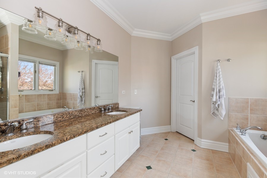 1032 Mar Ln Drive Lake Forest, IL 60045 - Photo 9 of 22 a spacious bathroom with a granite countertop sink mirror and double