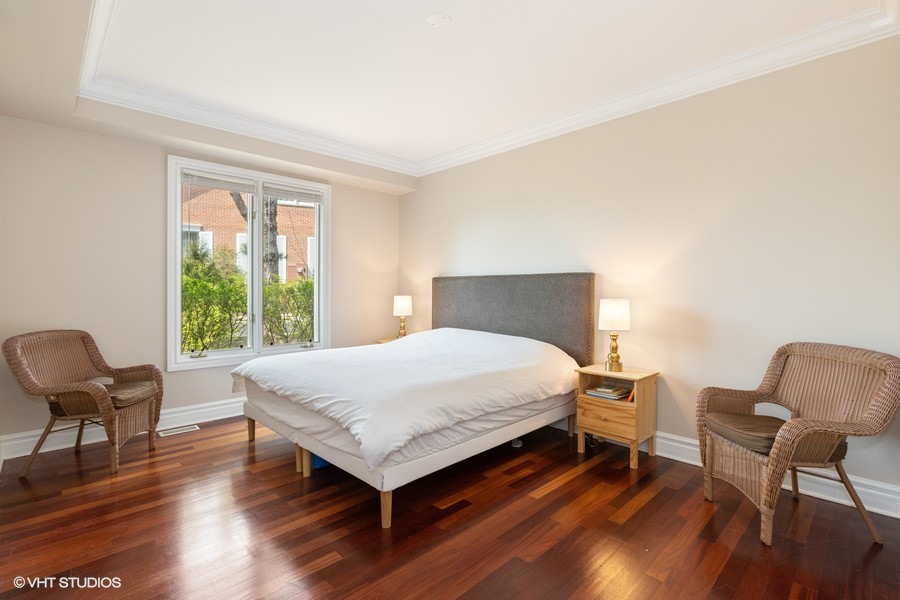 1032 Mar Ln Drive Lake Forest, IL 60045 - Photo 10 of 22 a bedroom with a bed and a chair