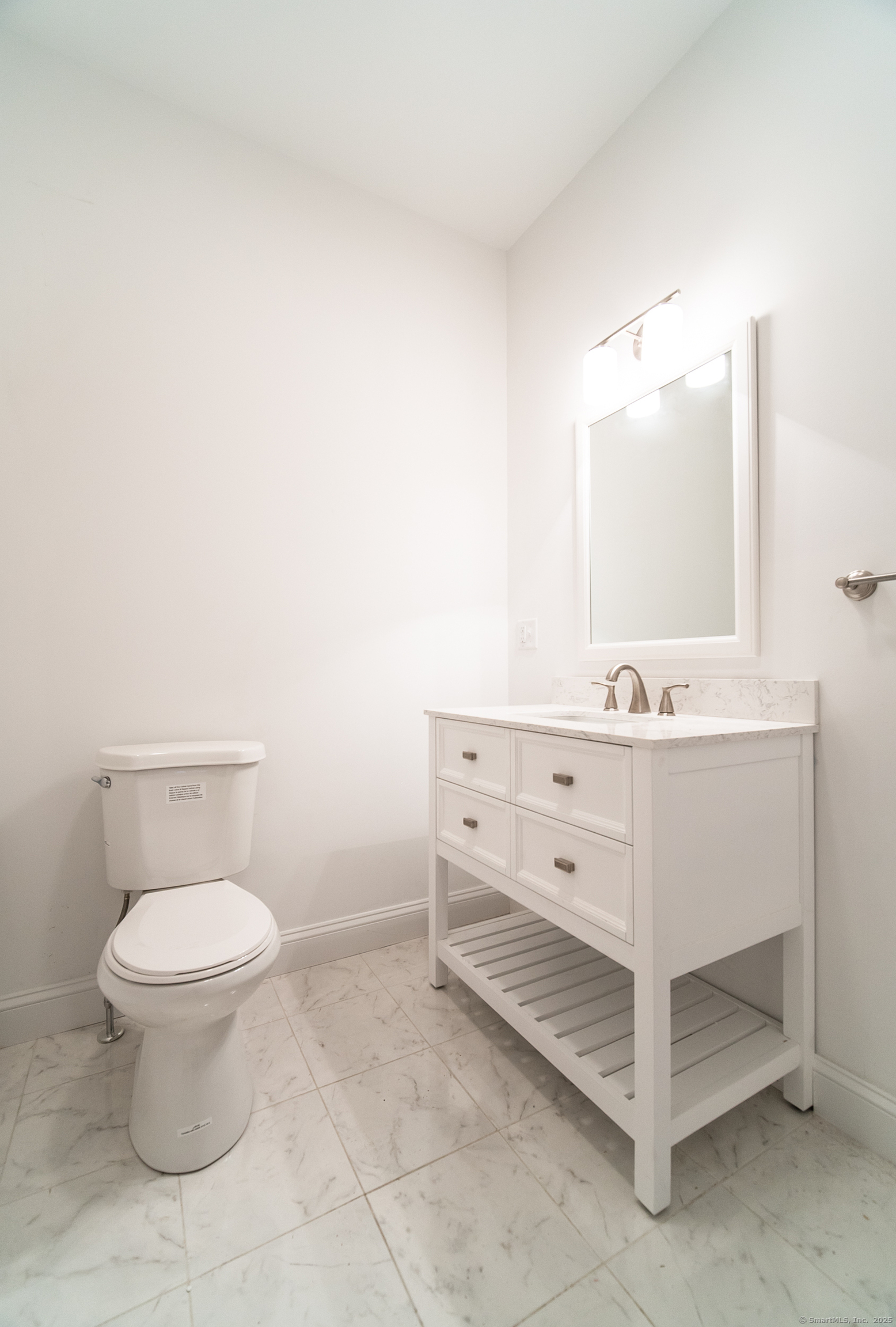 1154 Poquonnock Road, Unit 3 Groton, CT 06340 - Photo 13 of 17 a bathroom with a sink toilet and mirror