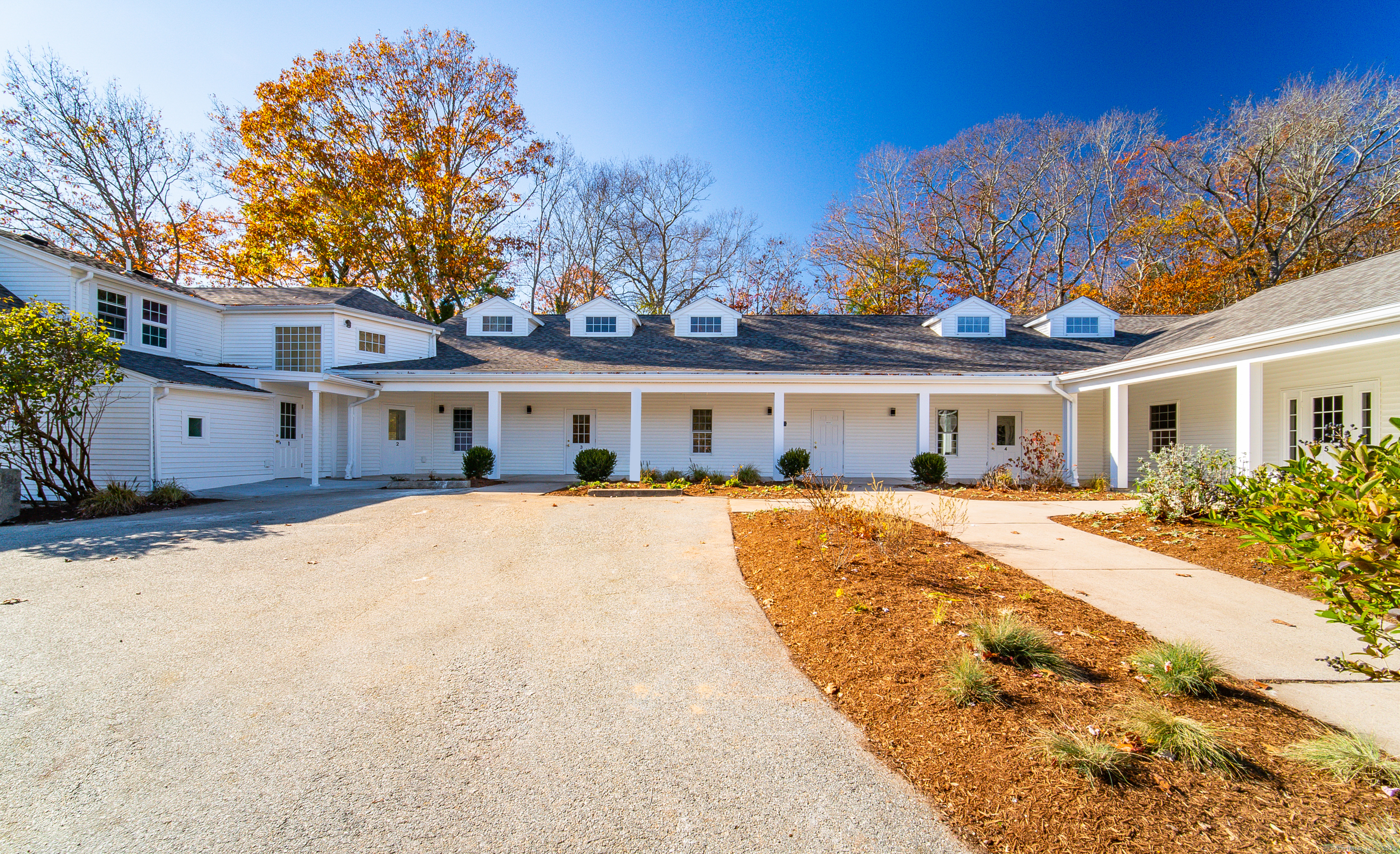 1154 Poquonnock Road, Unit 3 Groton, CT 06340 - Photo 15 of 17 a front view of a house with a yard and a garage