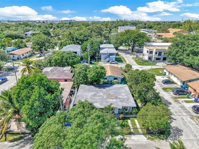 a view of a house with a small yard and plants