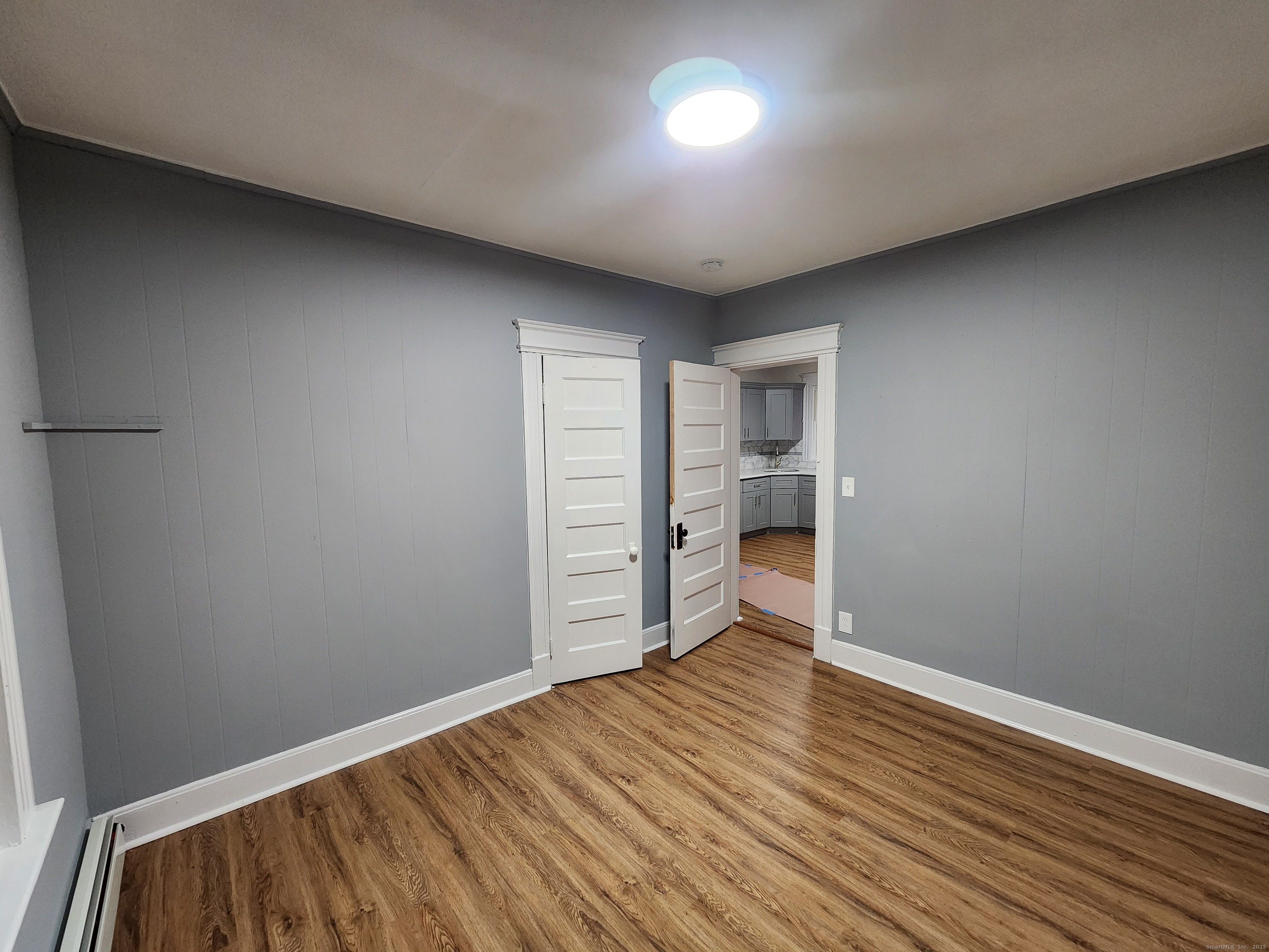 19 Sprague Street Waterbury, CT 06704 - Photo 2 of 12 a view of empty room with wooden floor