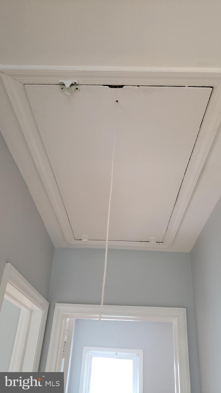 600 Braeside Road Baltimore, MD 21229 - Photo 29 of 32 PULLDOWN ATTIC STAIRS IN HALLWAY UPSTAIRS