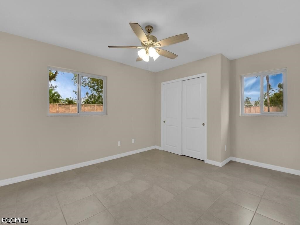 16560 Partridge Place Road, Unit 101 Fort Myers, FL 33908 - Photo 16 of 27 a view of workspace with window and ceiling fan