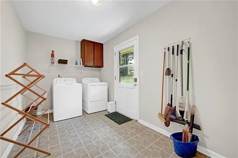 a bathroom with a sink toilet and a mirror