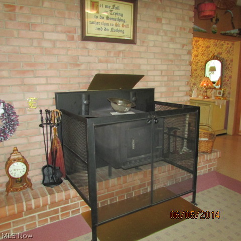 3901 Industry Road Rootstown, OH 44272 - Photo 10 of 22 The fire place in the family room has a wood burning insert.