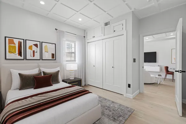 a bedroom with a bed and a view of bathroom