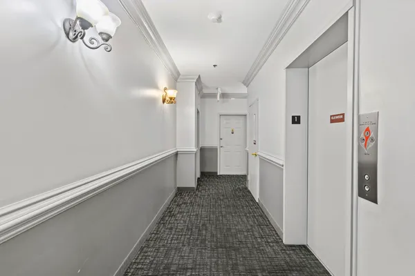 a view of a hallway with a white walls