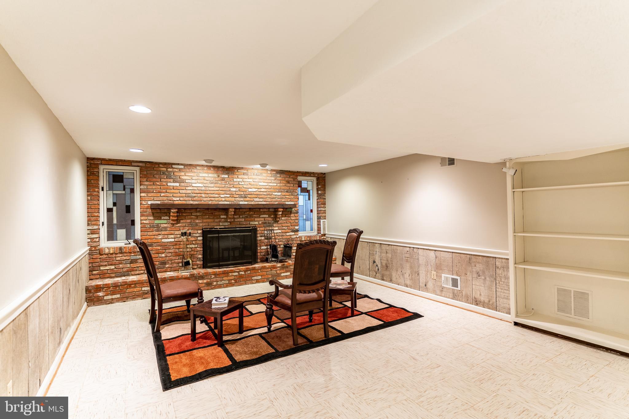9901 Bluegrass Road Potomac, MD 20854 - Photo 23 of 29 Lower Level Fireplace