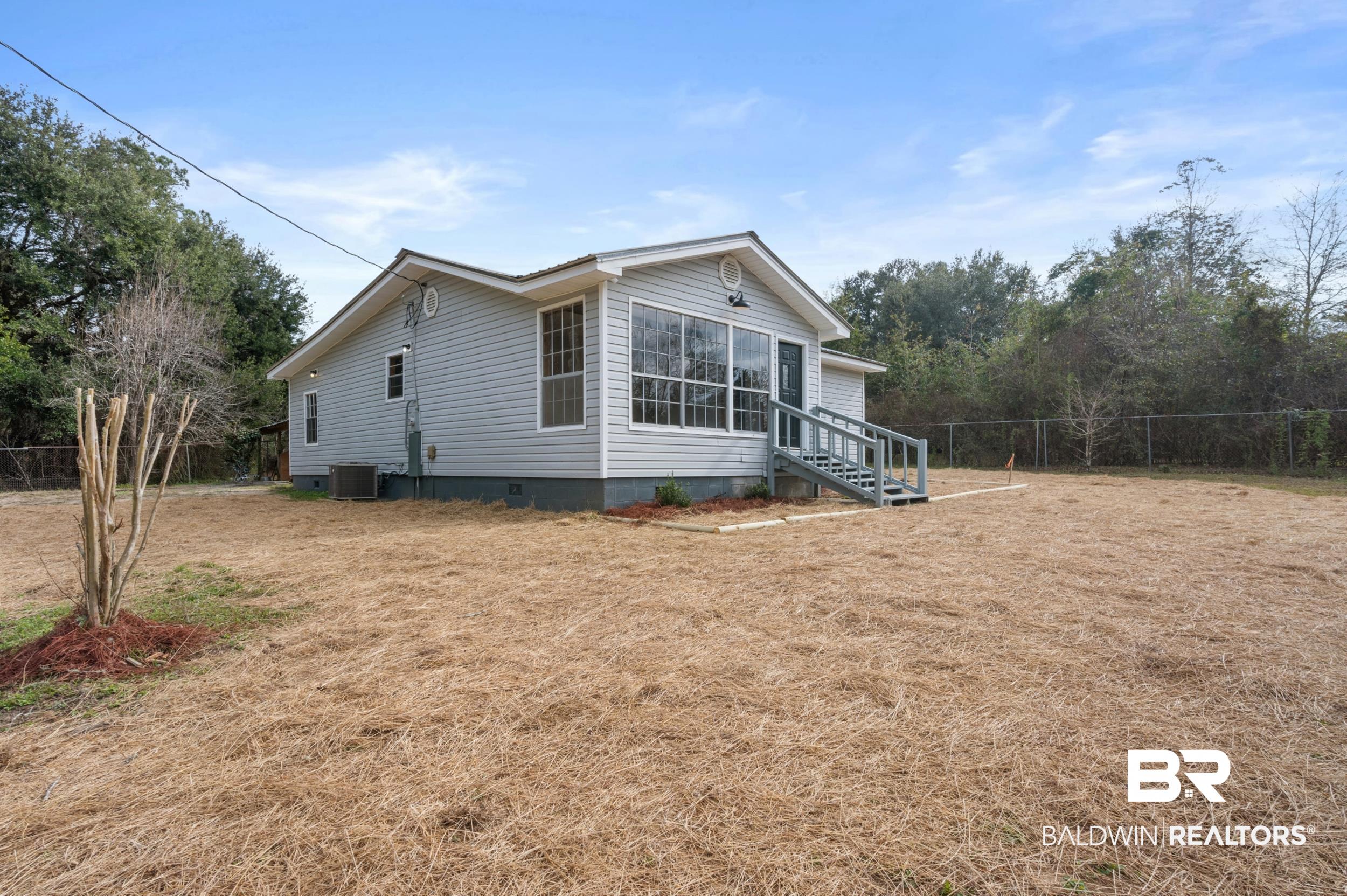 35780 Spring Road North Stapleton, AL 36578 - Photo 4 of 41 View of home's exterior featuring crawl space