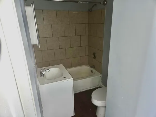 a bathroom with a toilet and a sink