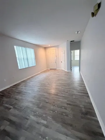 a view of an empty room and window