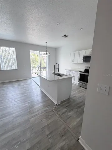 a living room with granite countertop furniture and fireplace