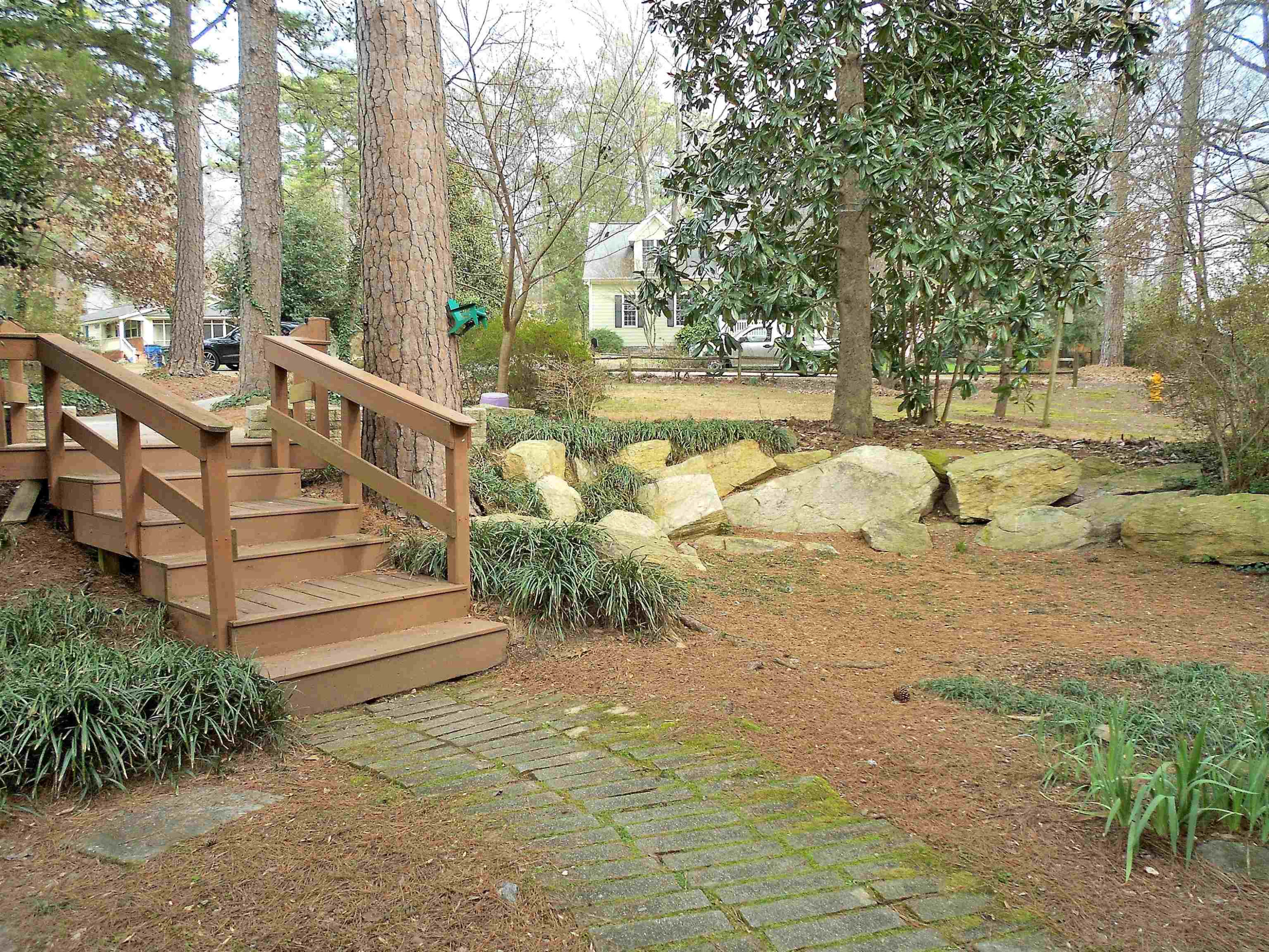 5805 Contour Drive Raleigh, NC 27612 - Photo 41 of 49 One of he current owners is a geologist -- could you tell by the massive rocks in the front yard? Front walkway and stairs
