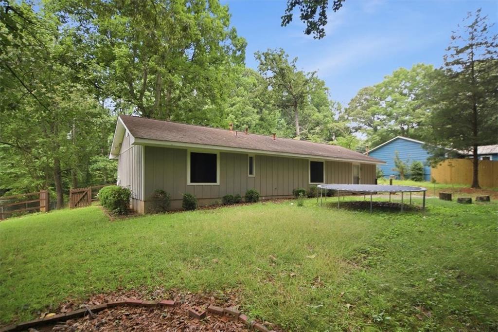 142 Deer Run Canton, GA 30114 - Photo 22 of 24 a view of a house with a yard