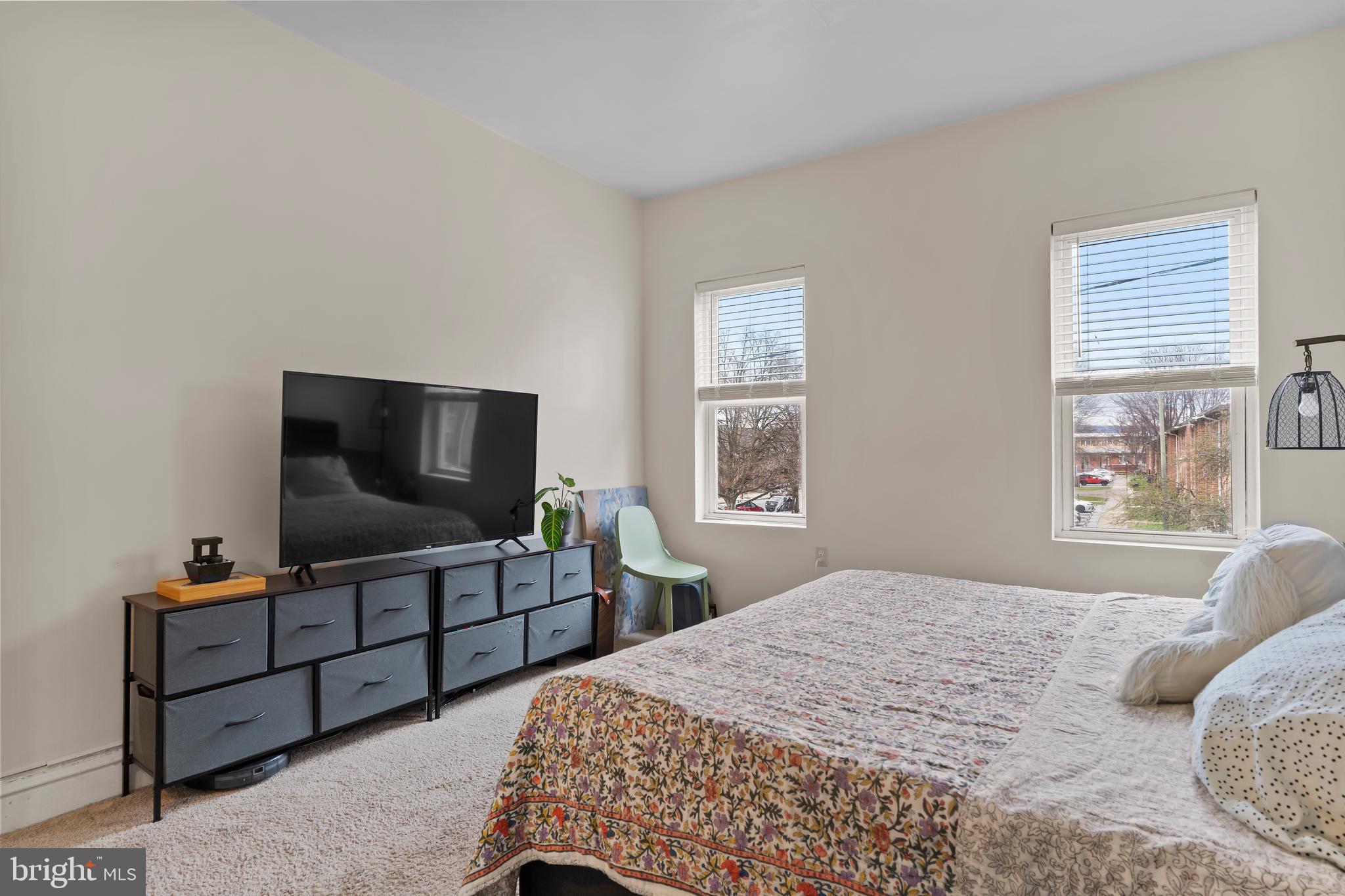 411 Herr Street Harrisburg, PA 17102 - Photo 13 of 18 a bedroom with a bed and a flat screen tv