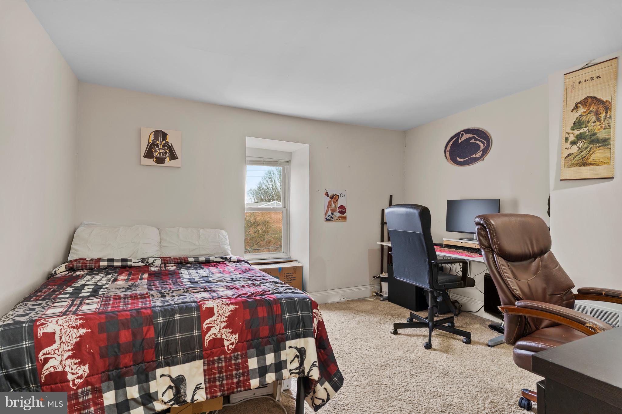 411 Herr Street Harrisburg, PA 17102 - Photo 14 of 18 a bedroom with a bed and a desk