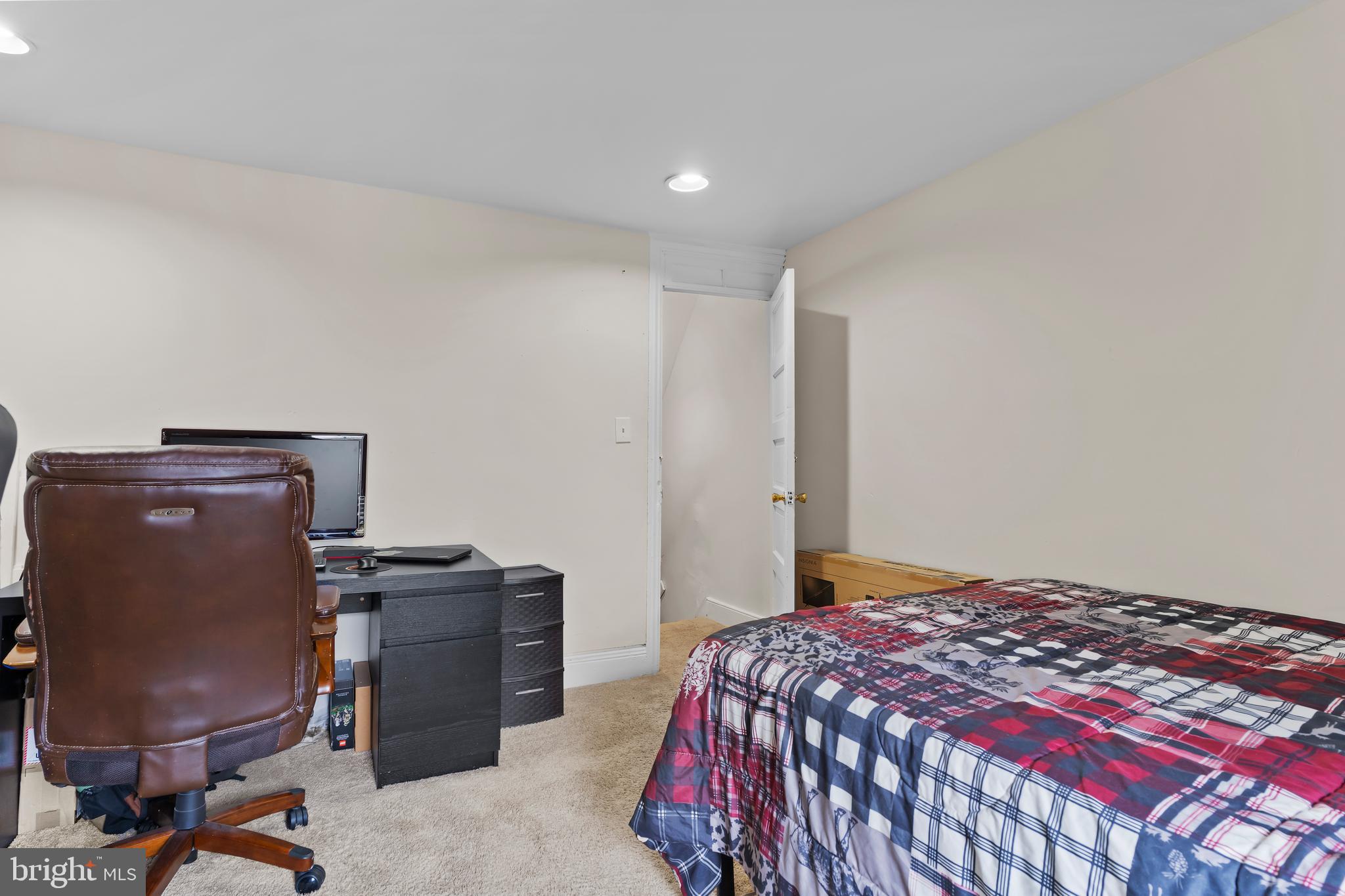 411 Herr Street Harrisburg, PA 17102 - Photo 15 of 18 a bedroom with a bed and a desk