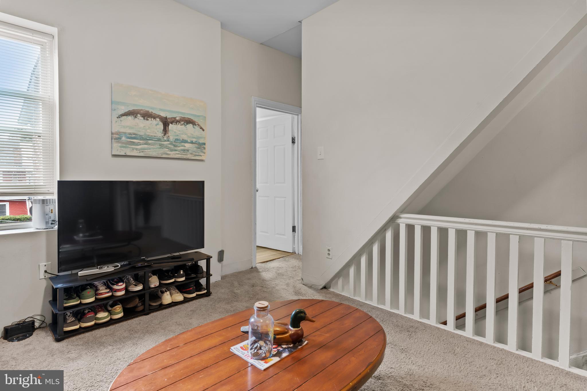 411 Herr Street Harrisburg, PA 17102 - Photo 10 of 18 a living room with furniture and a flat screen tv