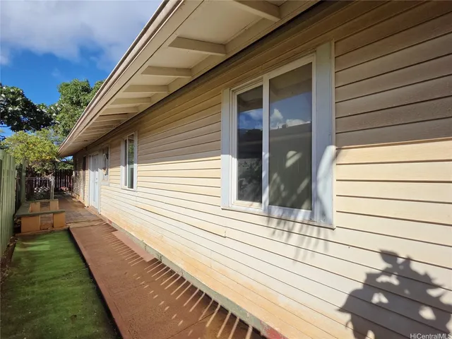 a view of a backyard with sitting area