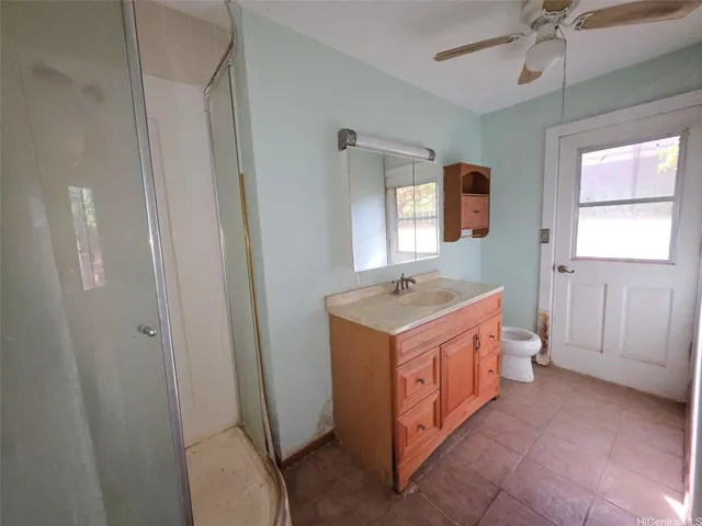 a room with a sink and a mirror