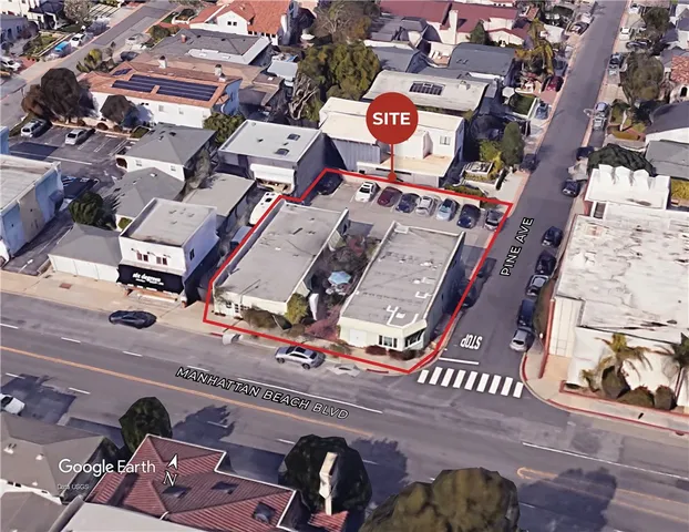 an aerial view of a building with parking
