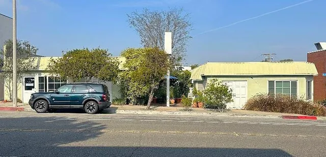 a car parked in front of a house