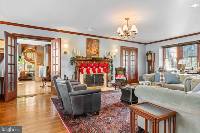 a living room with furniture or couch and a chandelier