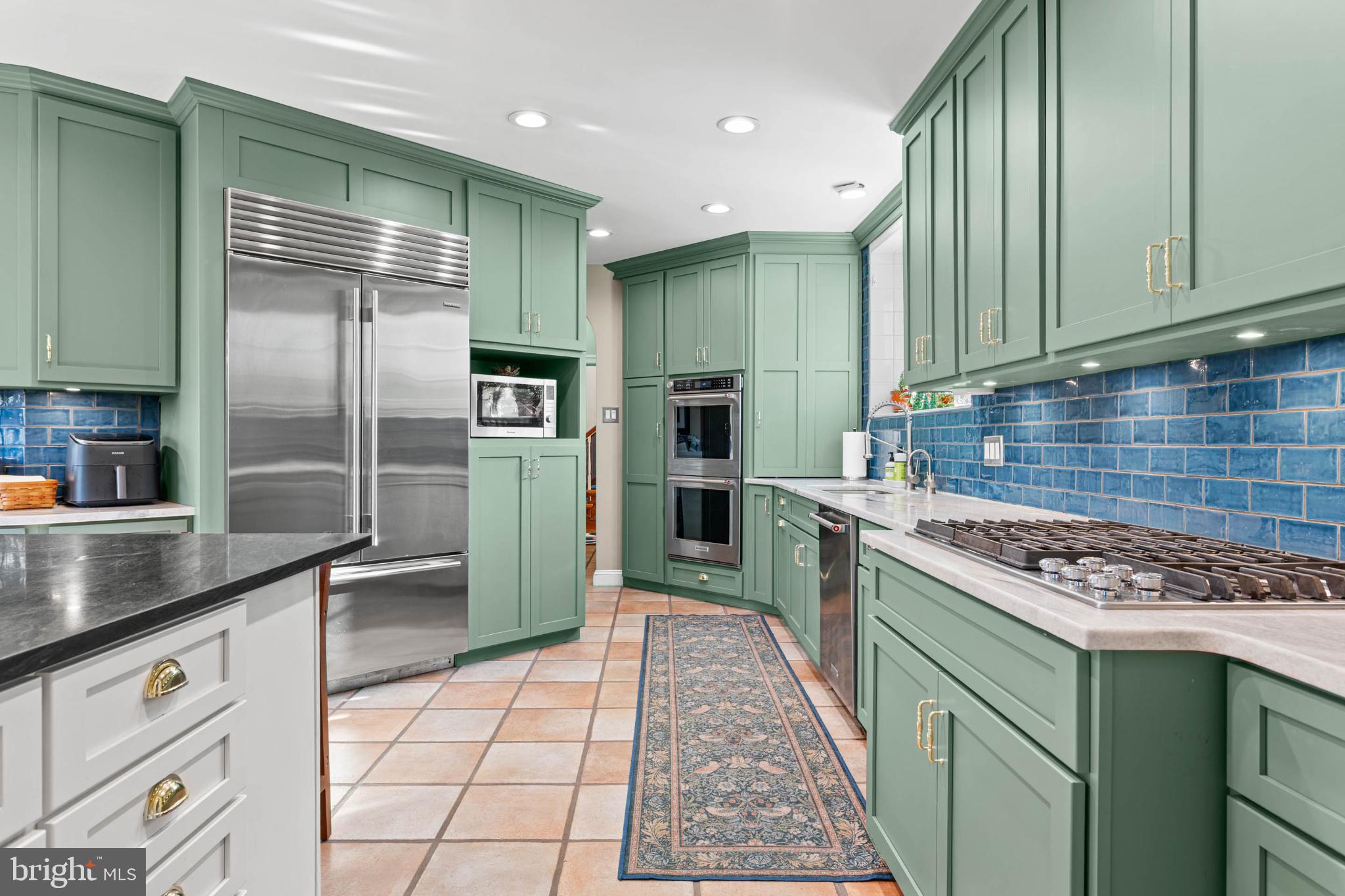 1432 Noble Road Rydal, PA 19046 - Photo 25 of 69 a kitchen with stainless steel appliances granite countertop a stove a sink and a refrigerator