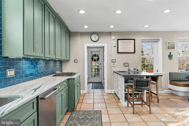 a living room with furniture and a book shelf