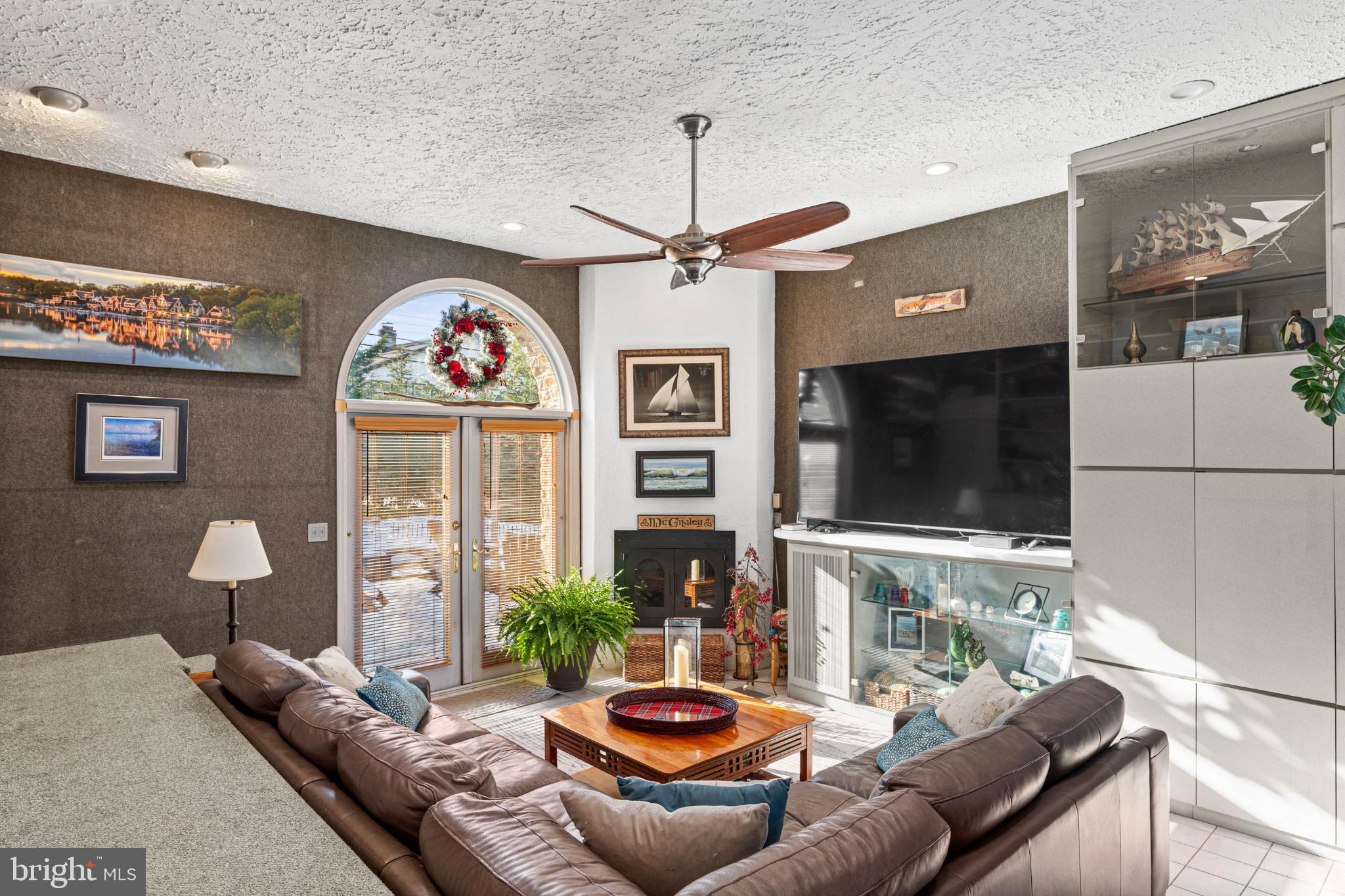 1432 Noble Road Rydal, PA 19046 - Photo 29 of 69 a living room with fireplace furniture and a flat screen tv