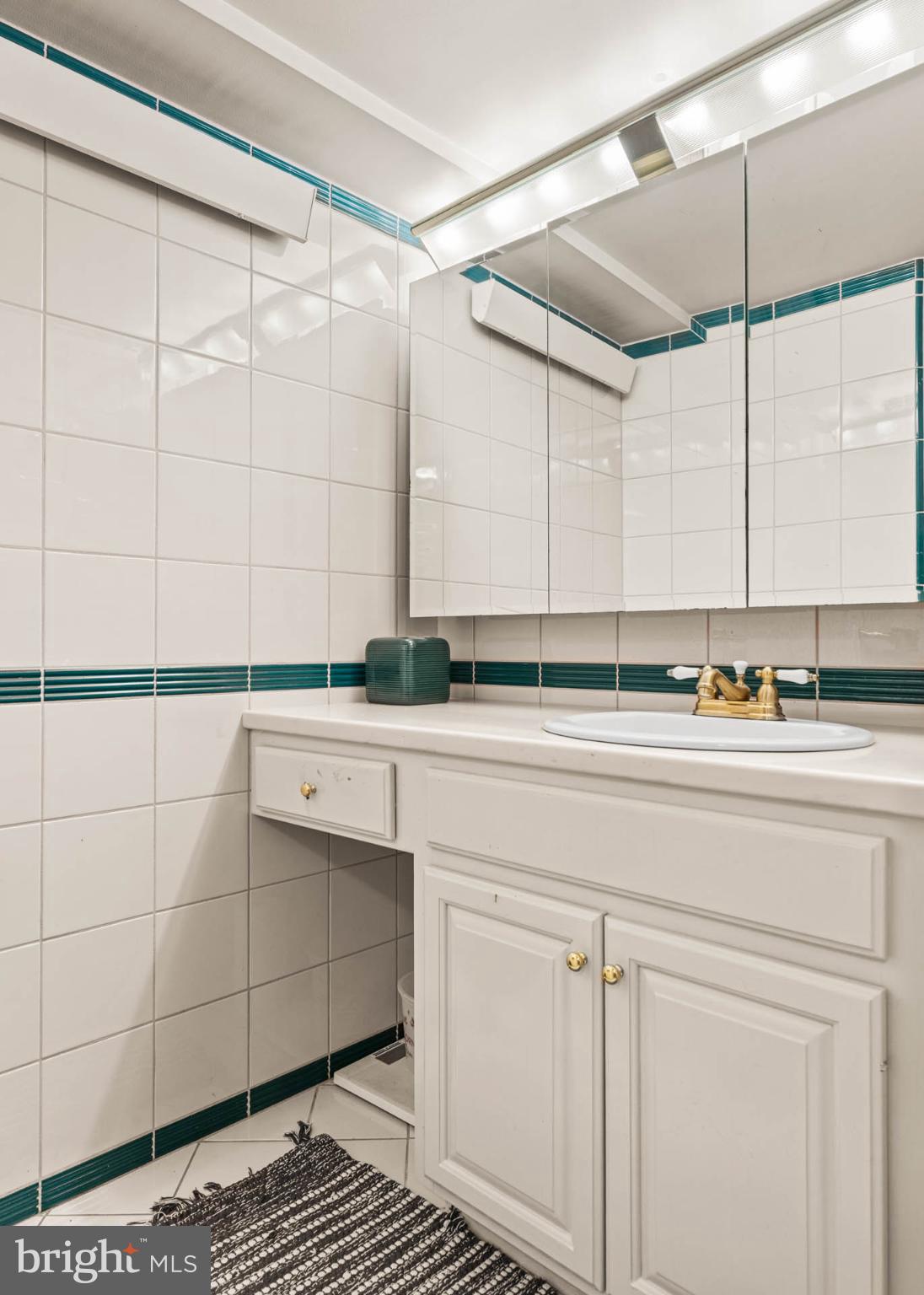 1432 Noble Road Rydal, PA 19046 - Photo 56 of 69 a bathroom with a sink and a mirror