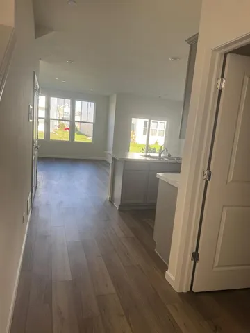 a bathroom with a toilet and a mirror