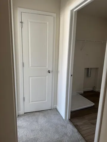 an empty room with wooden floor