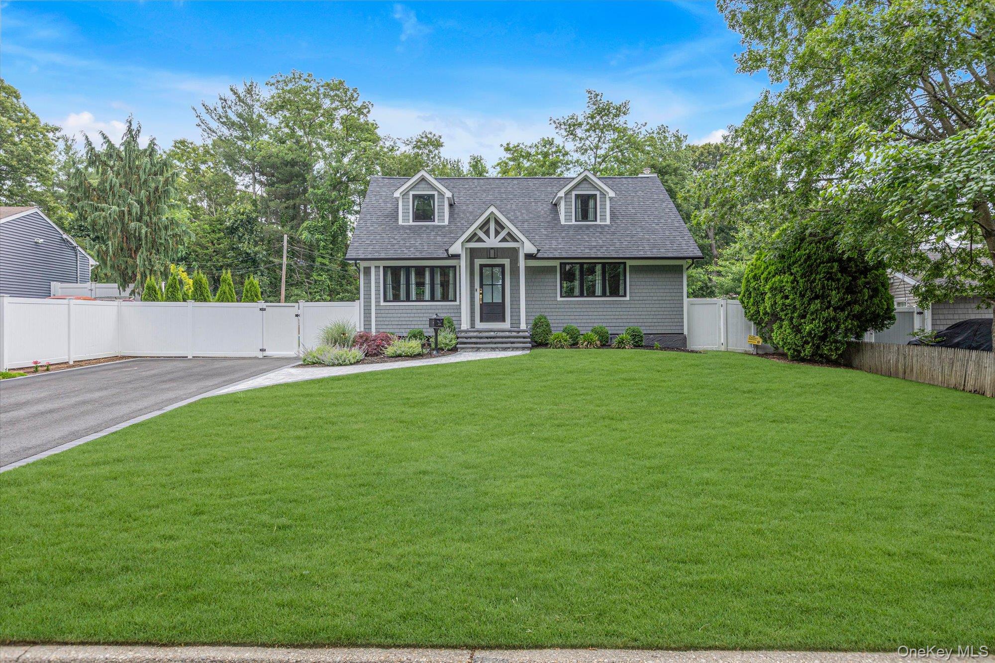 31 Apple Lane Commack, NY 11725 - Photo 1 of 28 Craftsman style home with large front yard and driveway.