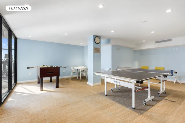 a living room with furniture a table and chairs