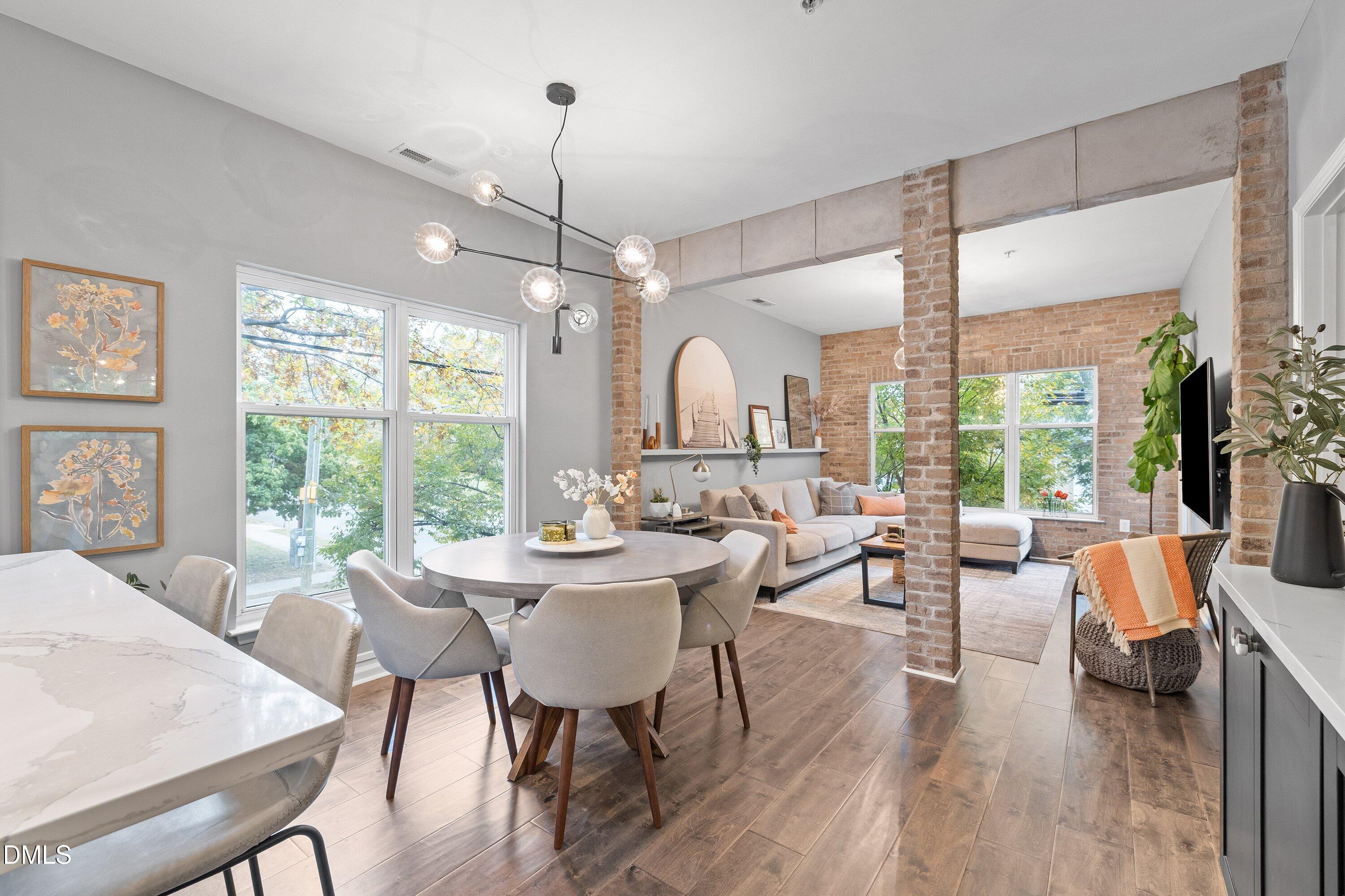 a view of a dining room with furniture window and outside view