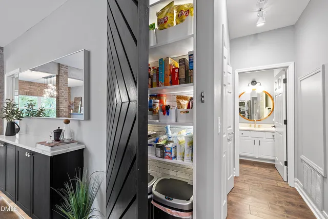 a view of a hallway with a washer and dryer