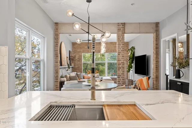 a outdoor living space with furniture and a flat screen tv