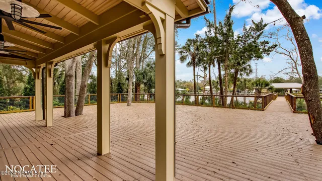 a view of balcony with wooden floor