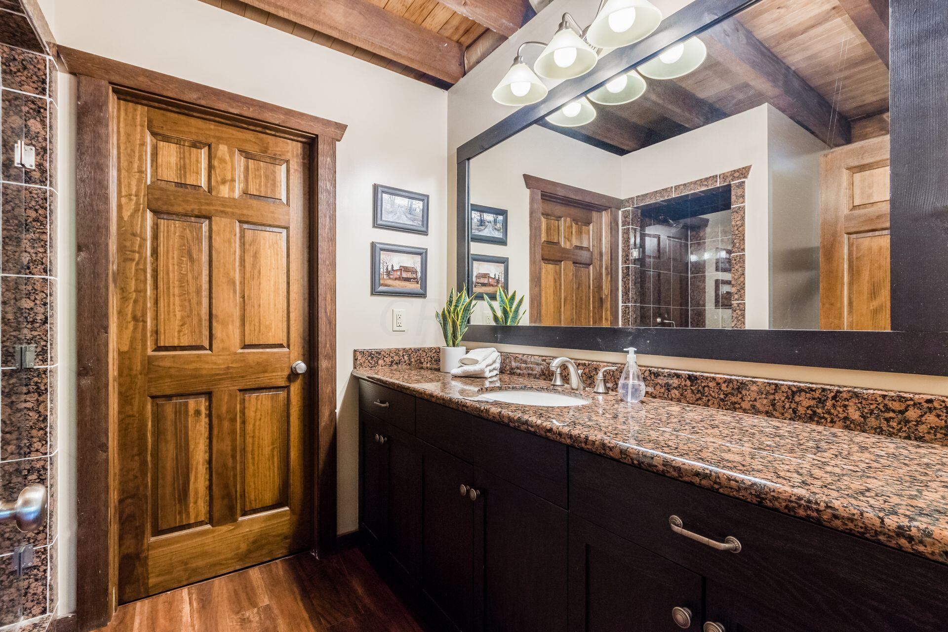 11444 Hazel Dell Road Howard, OH 43028 - Photo 20 of 41 First floor full bathroom and with mechanical room beyond.