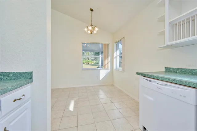 a view of a livingroom with a ceiling fan and window