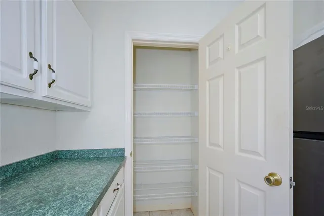 a bathroom with a granite countertop sink mirror and a