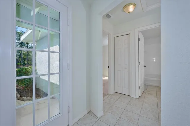 a view of an empty room with a window